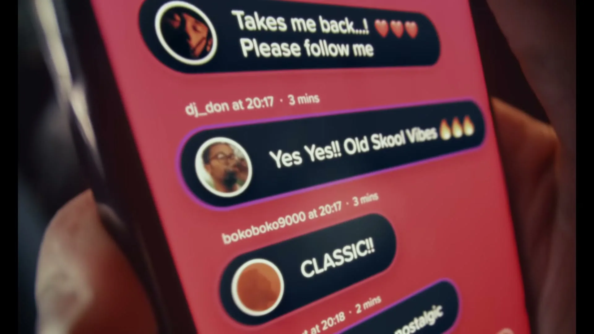 A person holds a smartphone displaying a social media feed with comments like "Takes me back...!" and "Yes Yes!! Old Skool Vibes" on a red background.