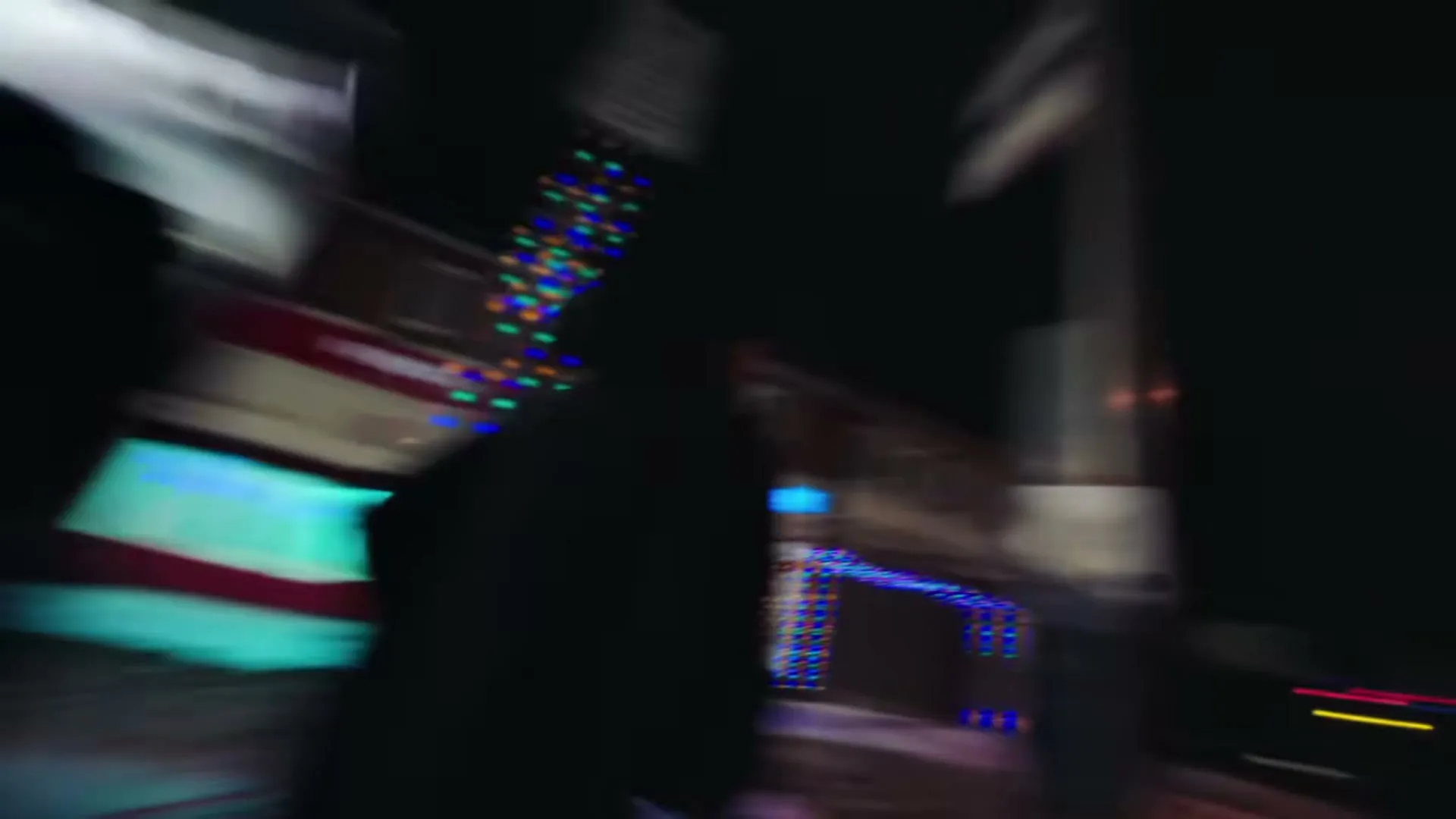 A group of diverse people in athletic wear stand at a snowy bus stop at night, then the camera spins to show them from above.