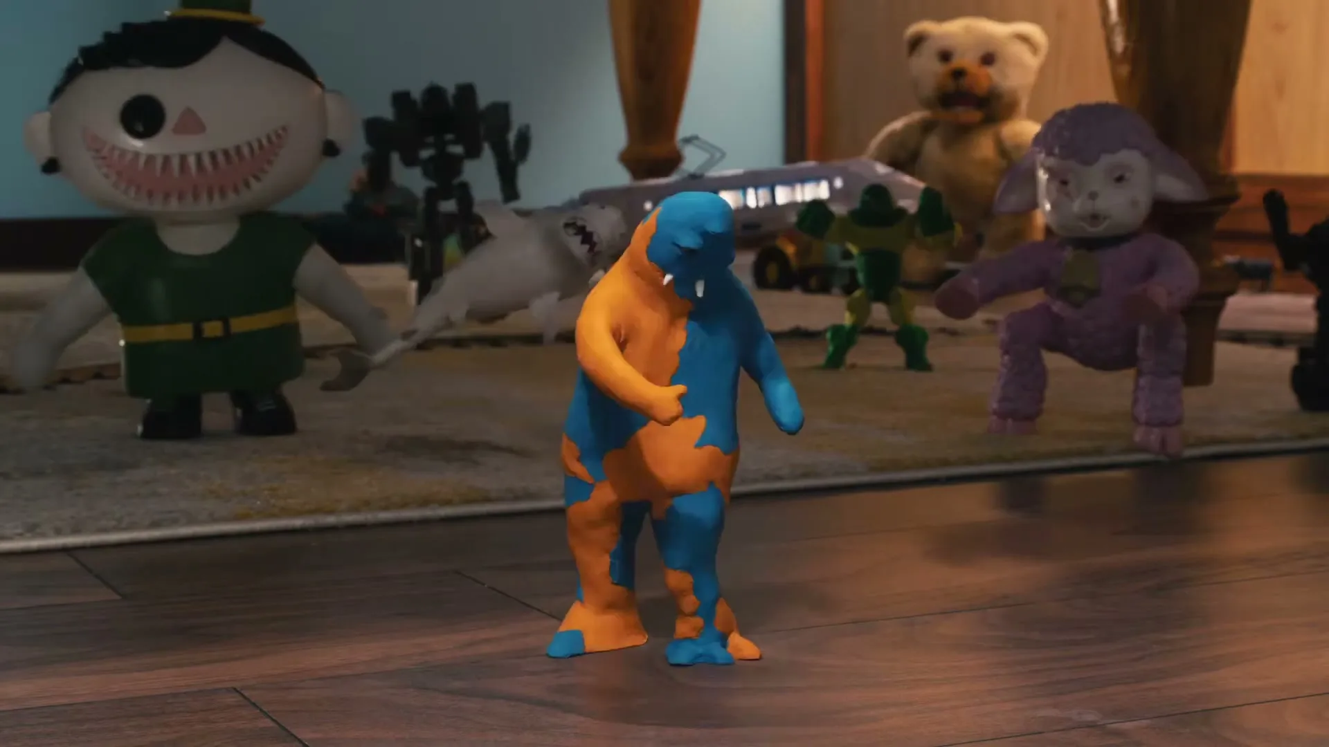 A blue and orange claymation monster with three eyes and fangs stands on a rug, surrounded by other toys, as the camera zooms in on its face.