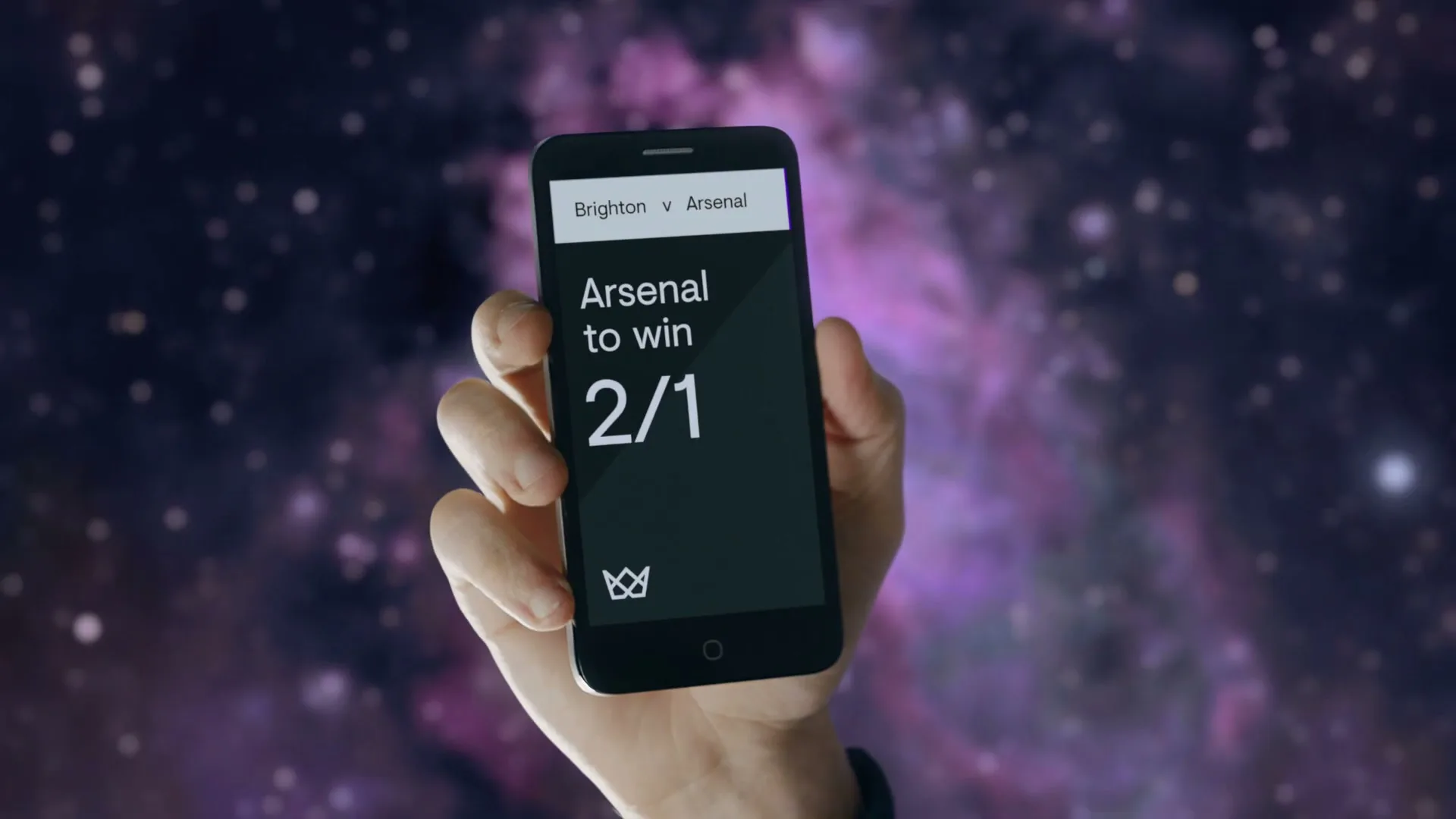 A hand holds a smartphone displaying a betting app, with the odds for "Arsenal to win" changing from 2/1 to 20/1 against a cosmic background.