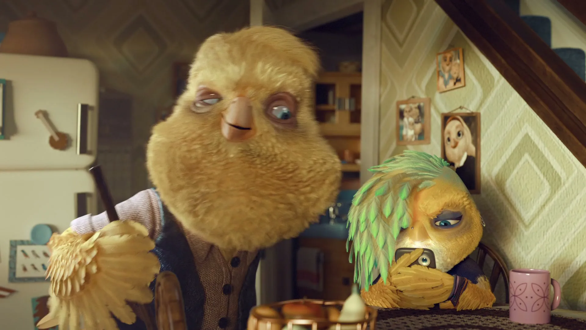 Two anthropomorphic bird-like creatures, one with green hair, are at a kitchen table, with one looking at a phone and the other looking at them.