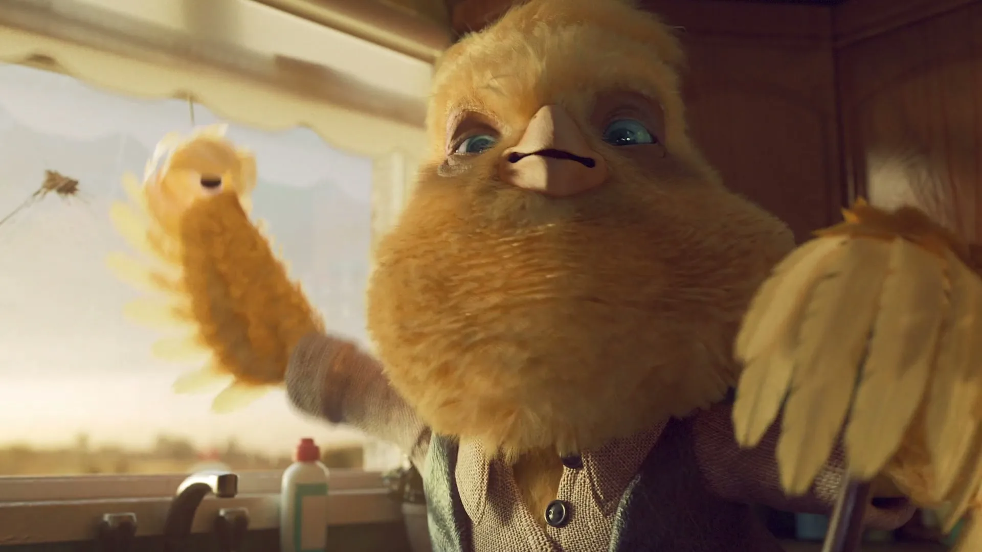 A fluffy yellow bird-like creature with blue eyes and a shirt washes dishes in a kitchen sink at golden hour.