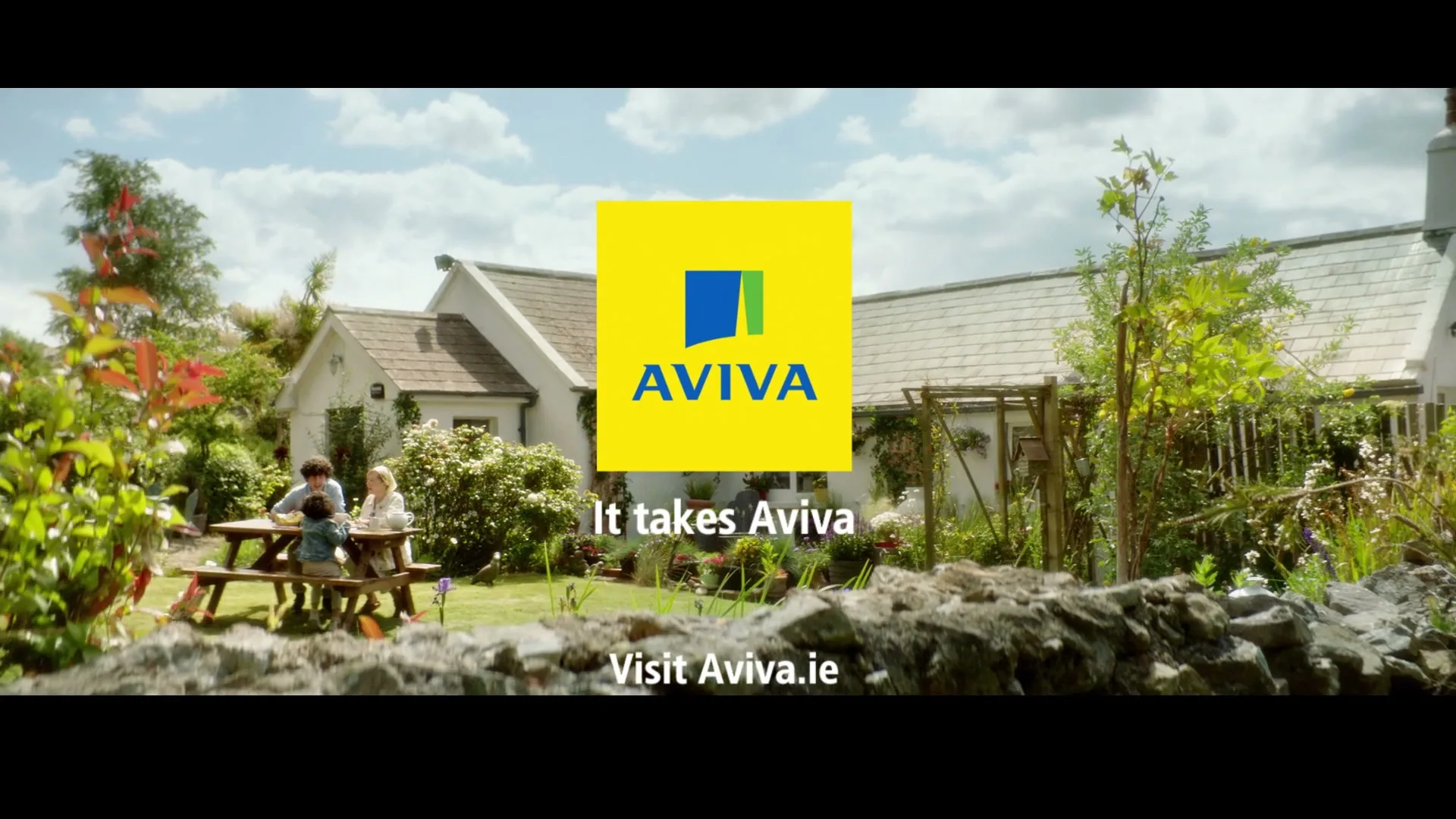 A family of four sits at a picnic table in a lush green garden outside a white house, with the Aviva logo and text superimposed.