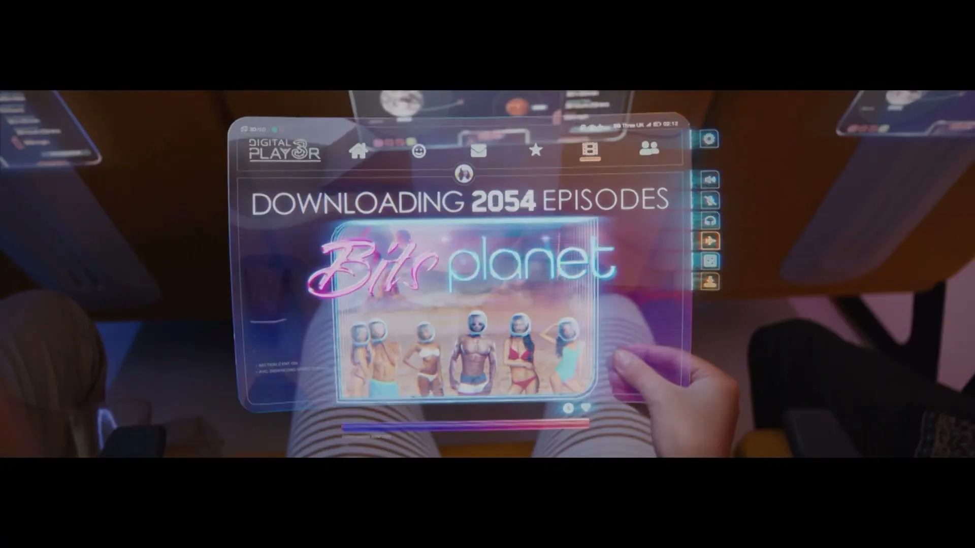 A person's hands interact with a futuristic transparent tablet displaying a video streaming interface, showing a download in progress.