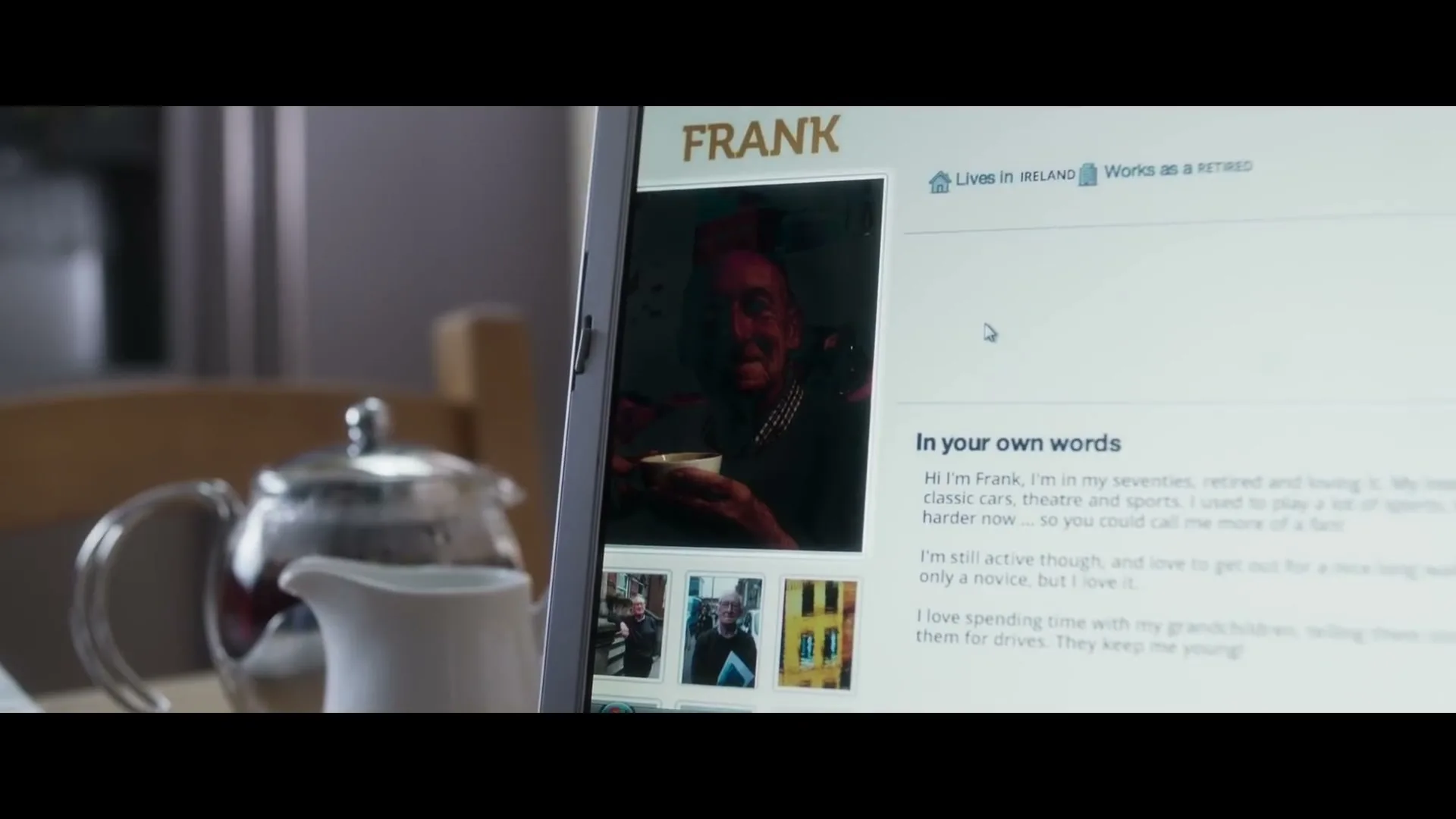 A laptop screen displays a dating profile for "Frank," a man in his seventies, with a teapot and creamer in the foreground.