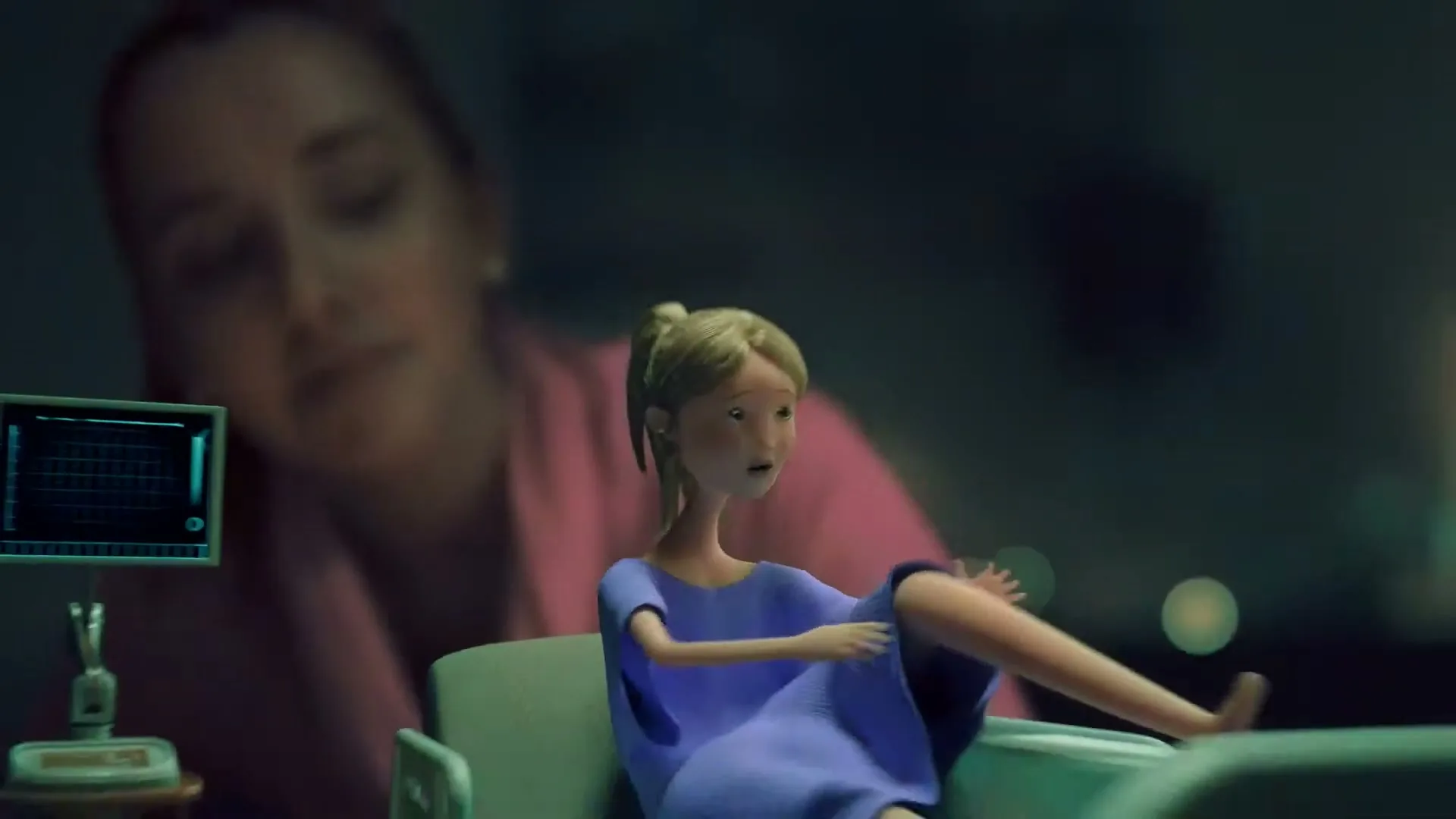 A small, animated woman in a hospital gown sits on a miniature hospital bed, while a blurred live-action woman watches over her in a dimly lit room.