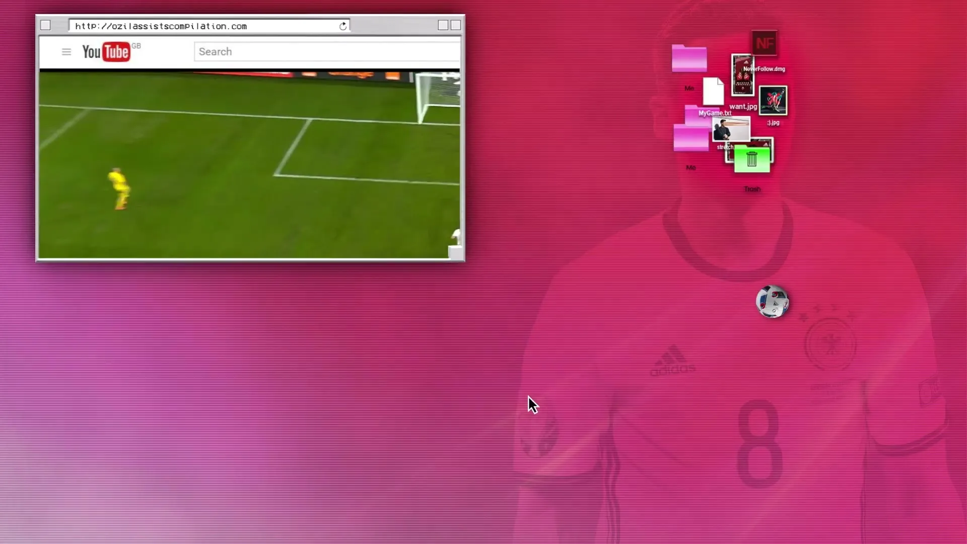 A computer screen shows a YouTube video of a soccer game, with a desktop background of a soccer player's jersey.
