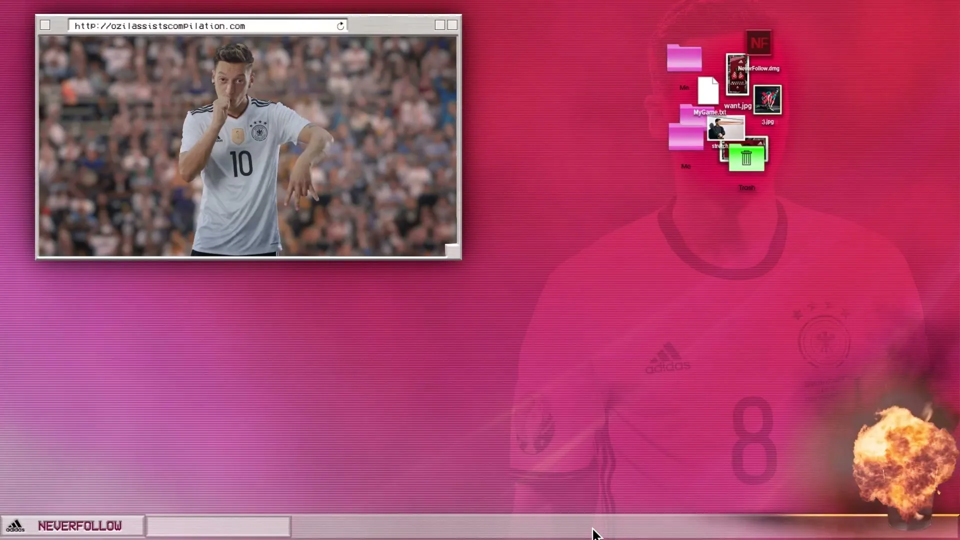 A computer screen shows a video of a male soccer player in a white jersey making a shushing gesture on a field.