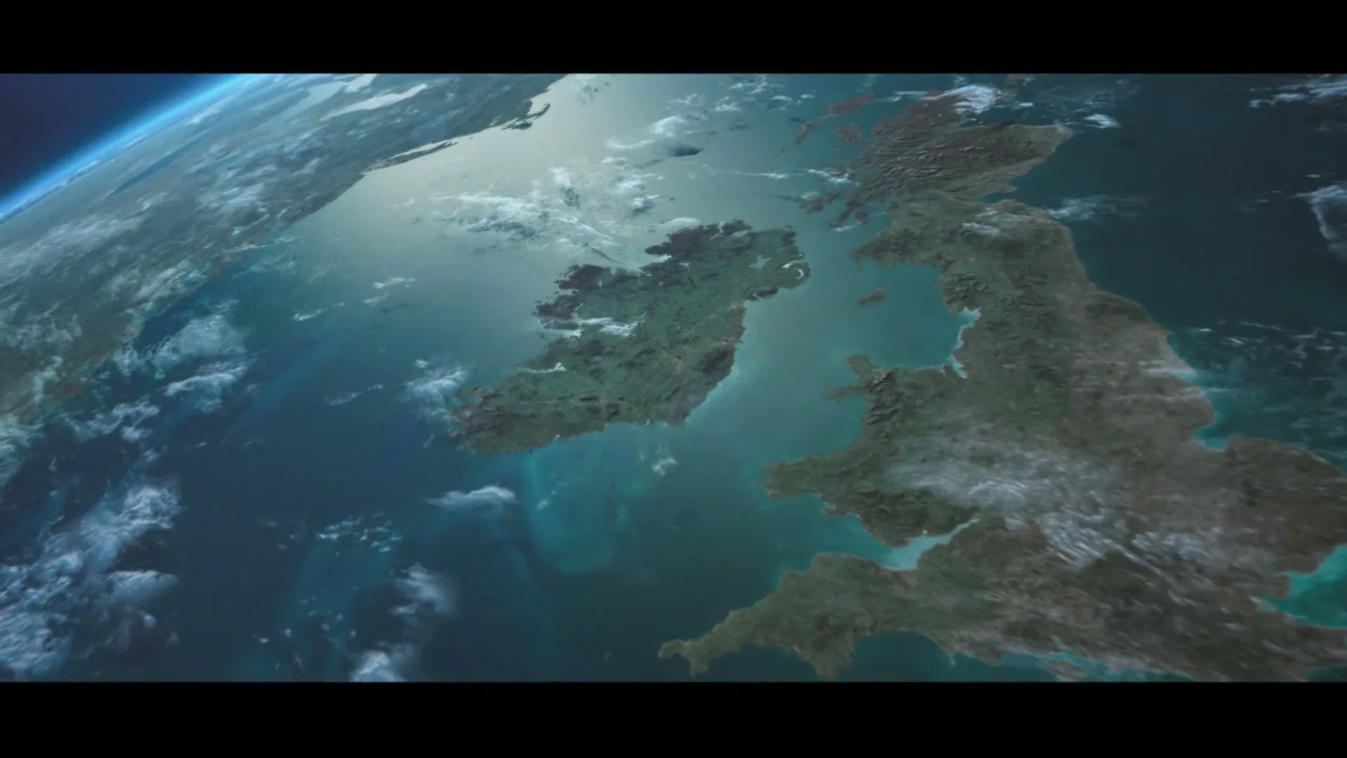 A wide shot of the Earth from space, showing Ireland and the UK, with sunlight reflecting off the ocean.