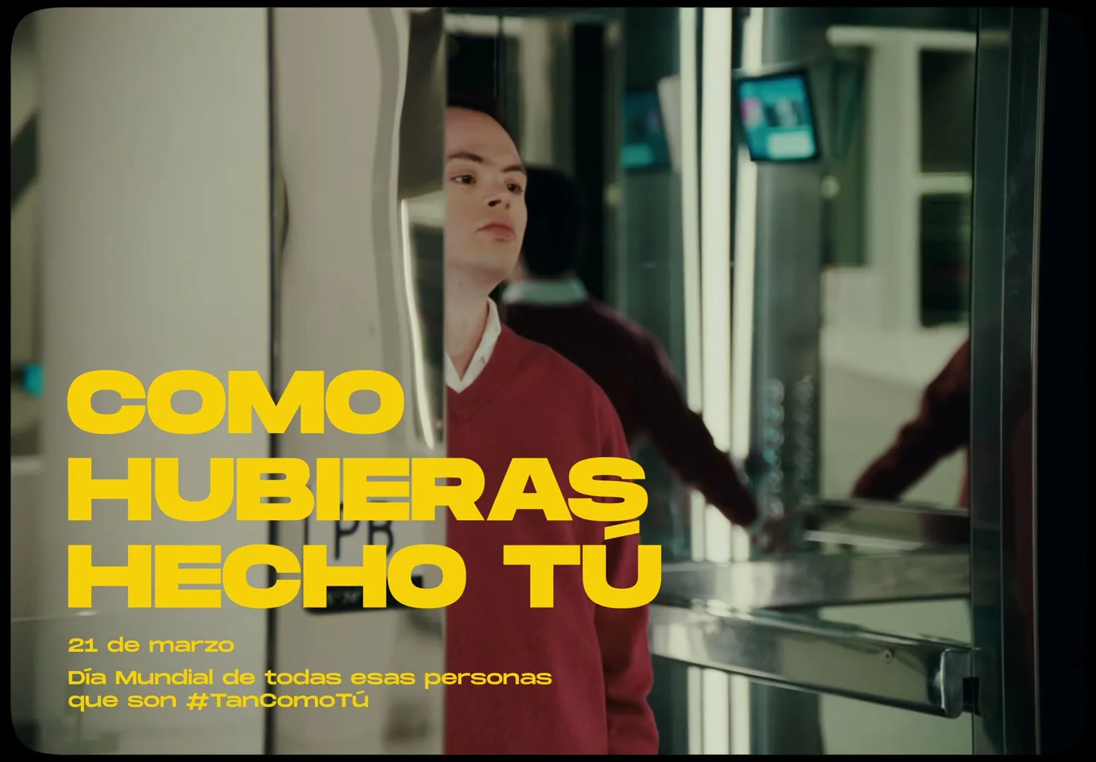 A young man with Down syndrome stands in a modern building, looking up and to the right, as text overlays the scene.