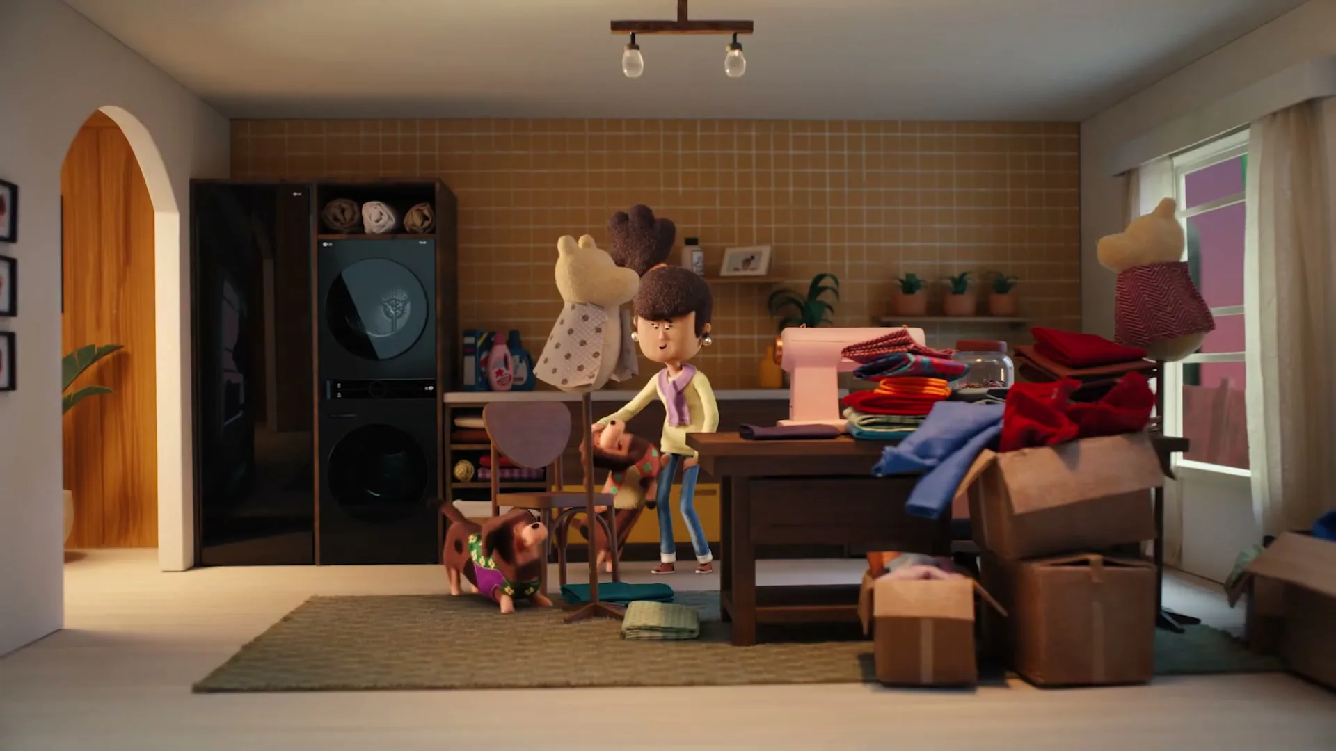 A stop-motion animated woman with dark hair and a yellow sweater folds clothes in a messy room with two dogs and a washing machine.