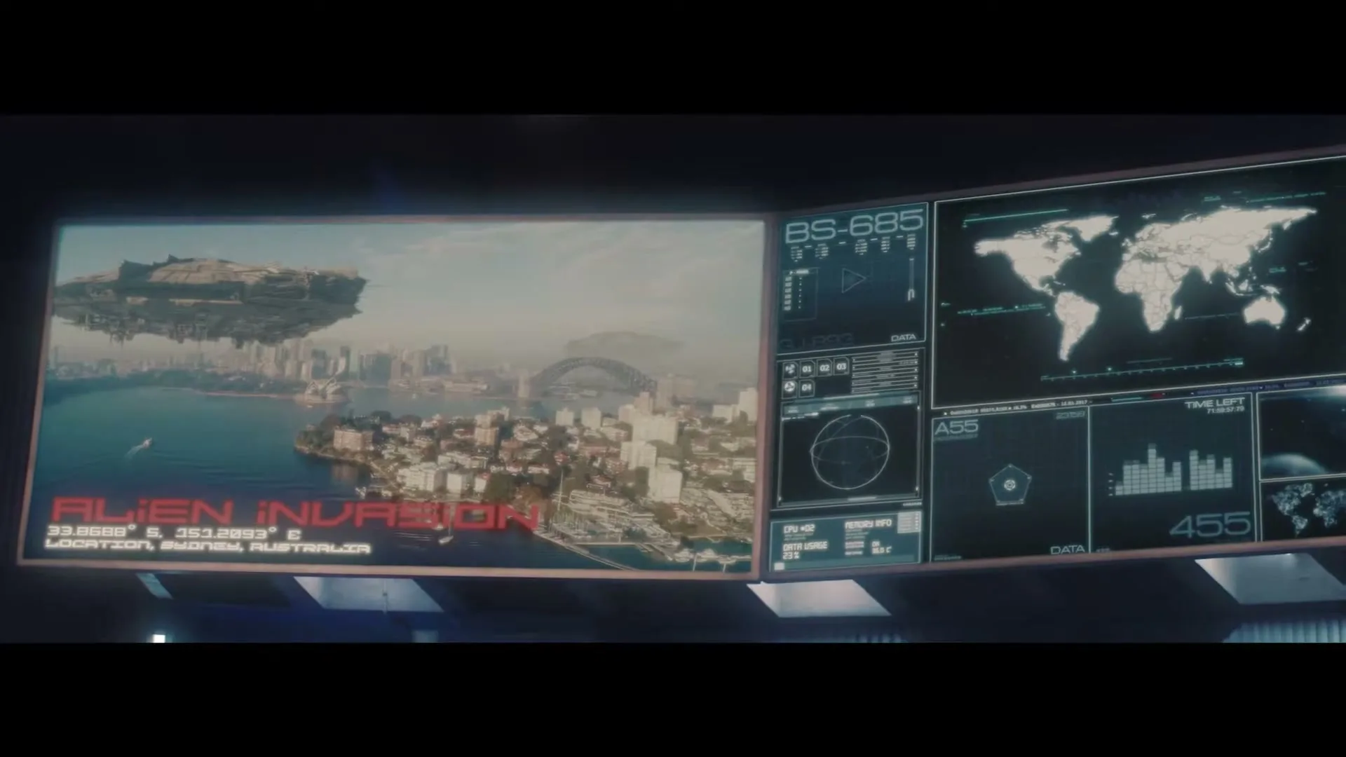 A large screen displays a CG image of an alien spaceship hovering over Sydney, Australia, with various data screens on the right.