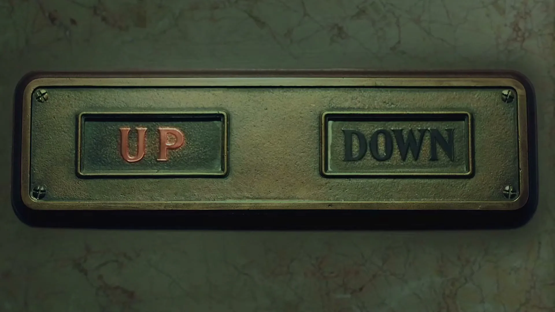 A close-up shot of an old, ornate brass elevator button panel with "UP" and "DOWN" labels, set against a marble wall, as the "UP" button illuminates red.