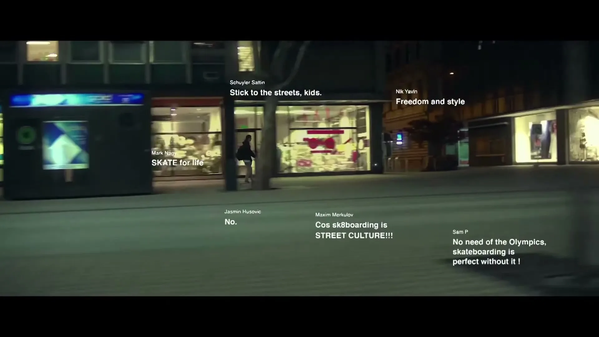 A lone skateboarder glides across a city square at night, surrounded by buildings and on-screen text comments about skateboarding.