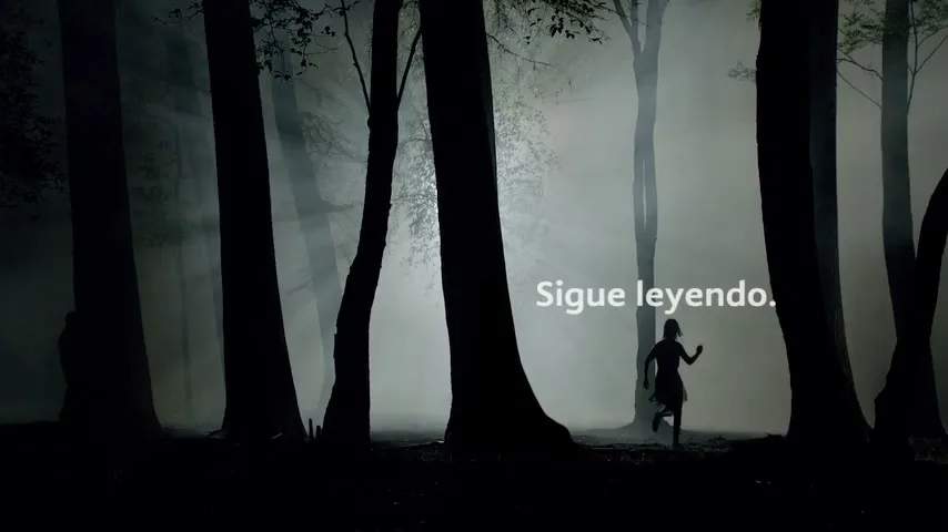 A young girl, silhouetted, runs through a dark, misty forest with tall trees, as white text appears on screen.