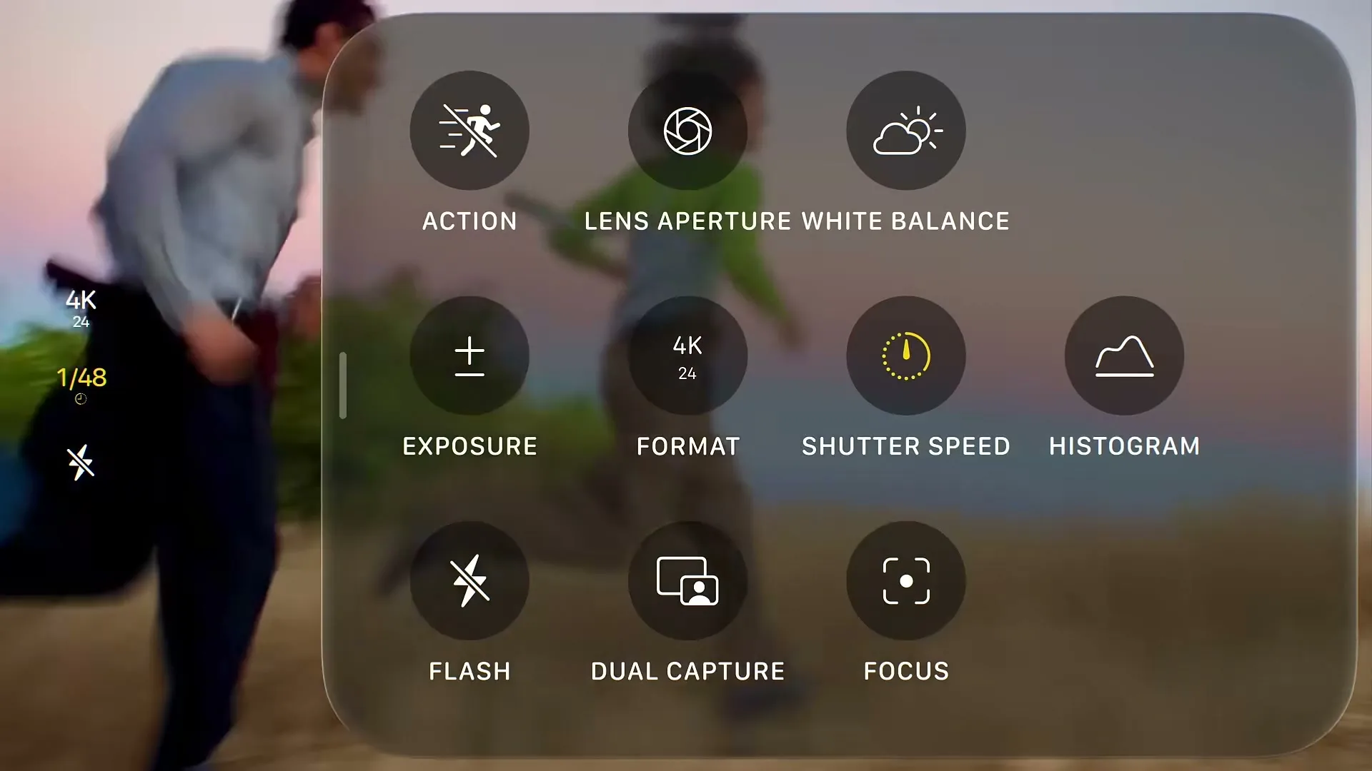 A blurred shot of three people running up a grassy hill at dusk, with a transparent phone UI overlay showing camera settings.