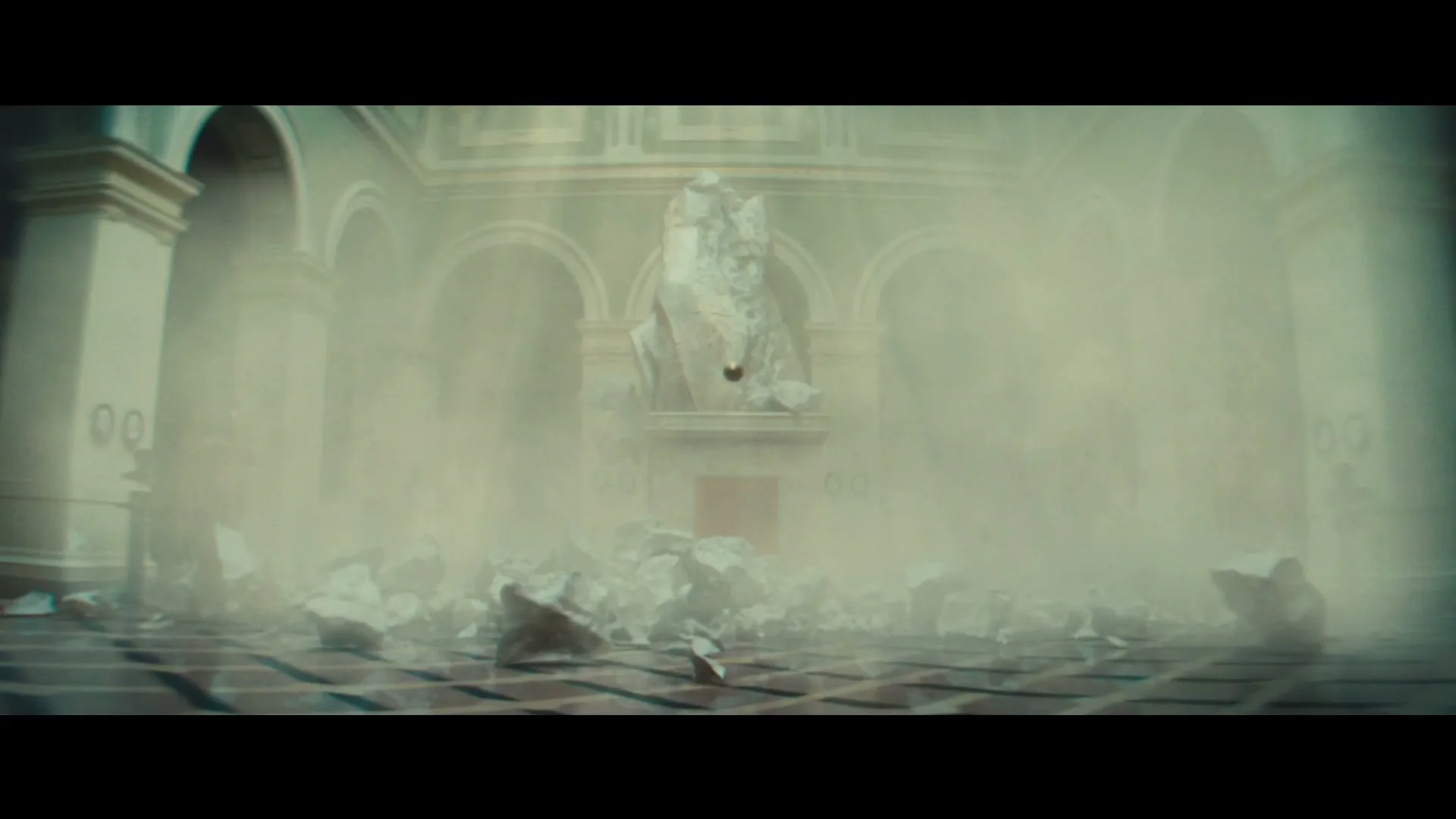 A golden orb floats in a dusty, ruined museum hall with a broken statue and debris on the floor, as light streams in.