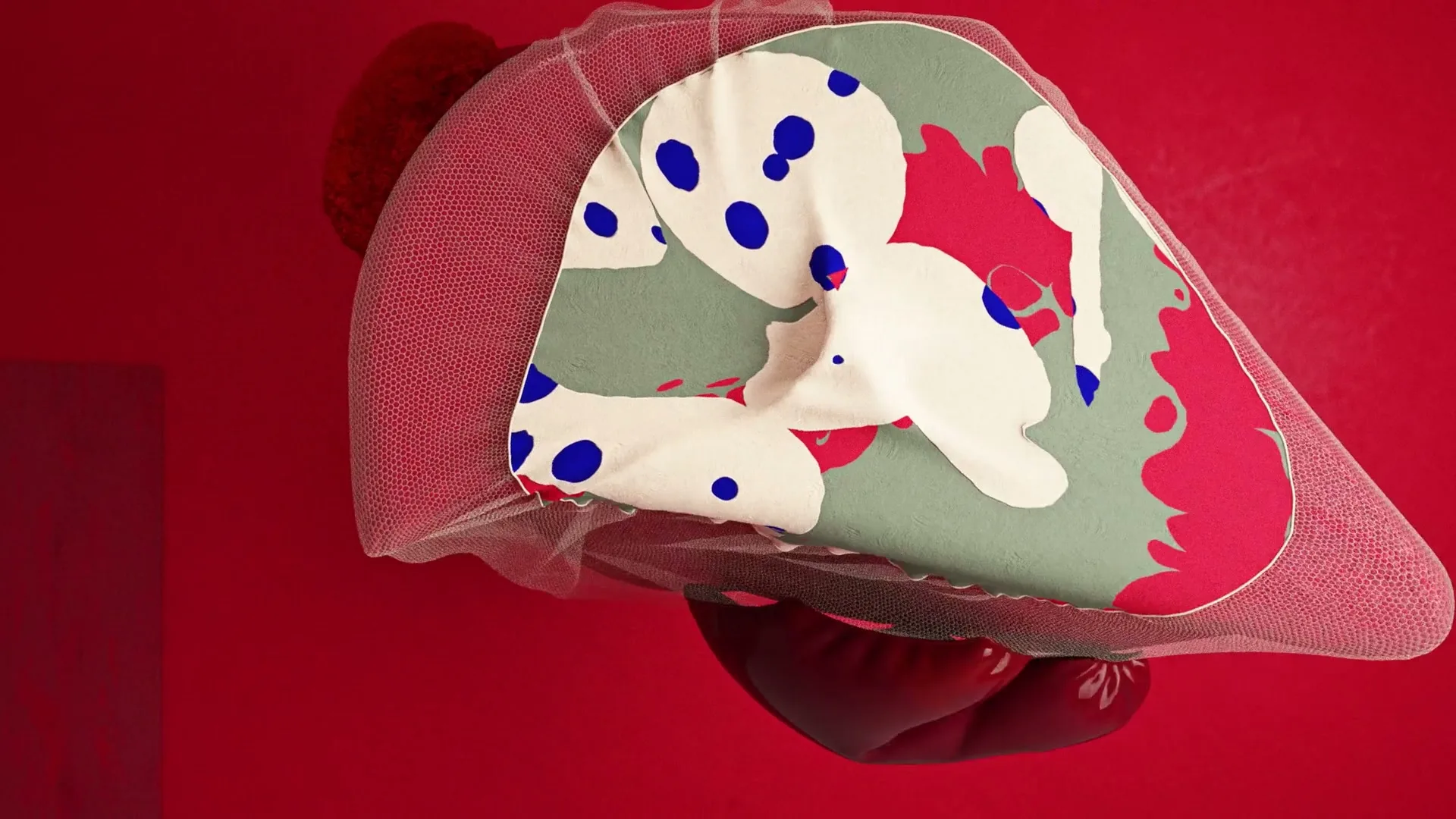 A colorful, abstract, organic shape with polka dots and splatters, covered by a sheer mesh, rotates against a vibrant red background.