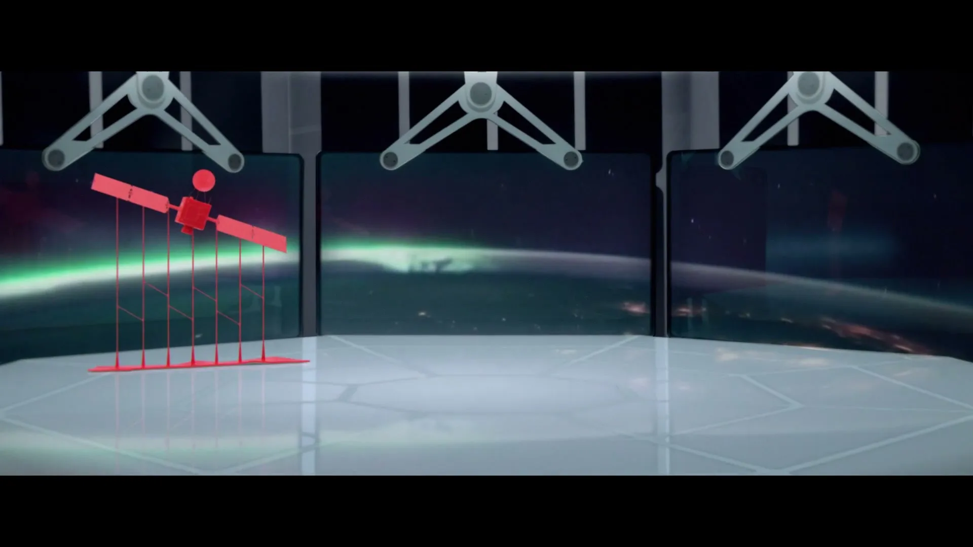 A red animated satellite graphic is displayed on a futuristic control desk, with three large screens showing Earth from space with the aurora borealis.