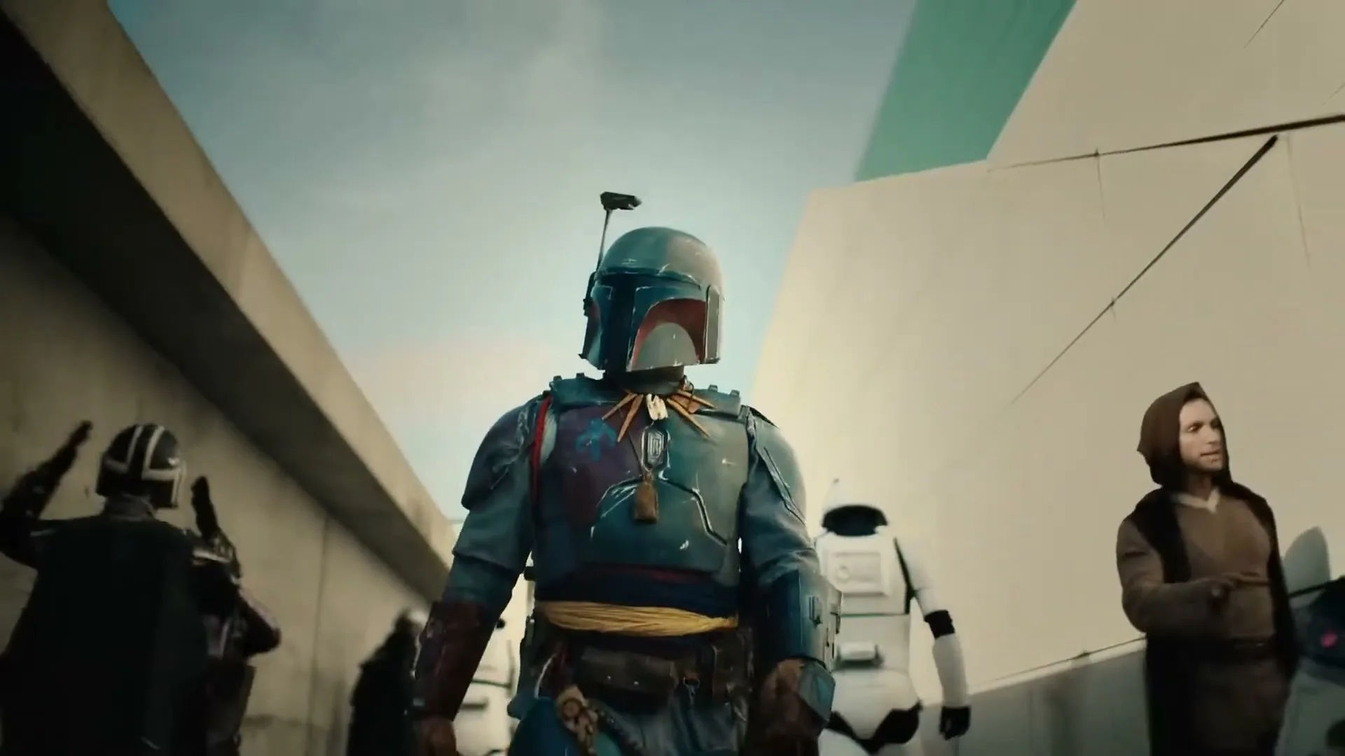 A person in Boba Fett armor walks forward, surrounded by other Star Wars characters, in a bright, outdoor setting.