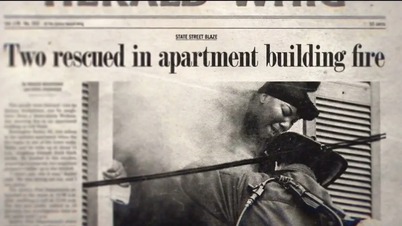 A black and white newspaper headline reads "Two rescued in apartment building fire" with a blurry image of a firefighter spraying water.