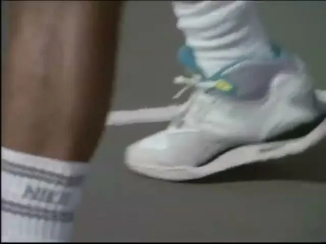 A man in a black tank top dunks a basketball, then a tennis player holds a racket, and finally a man plays guitar.