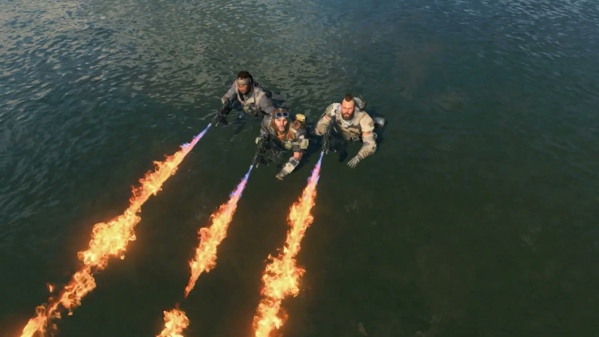 Three soldiers in tactical gear emerge from the water, firing flamethrowers, in an outdoor setting.