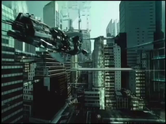 A futuristic cityscape with tall buildings and a large, dark, flying vehicle moving through the air.