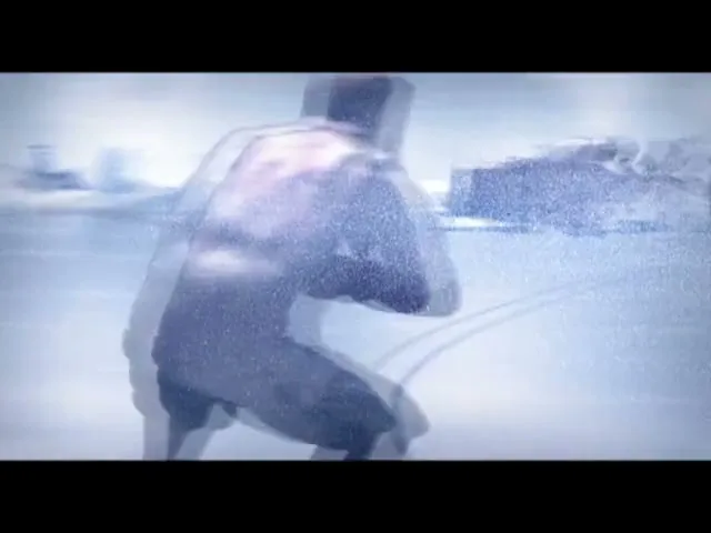 A male figure in a futuristic suit is pulled by a motorcycle across a snowy, icy landscape, with other vehicles in the background.