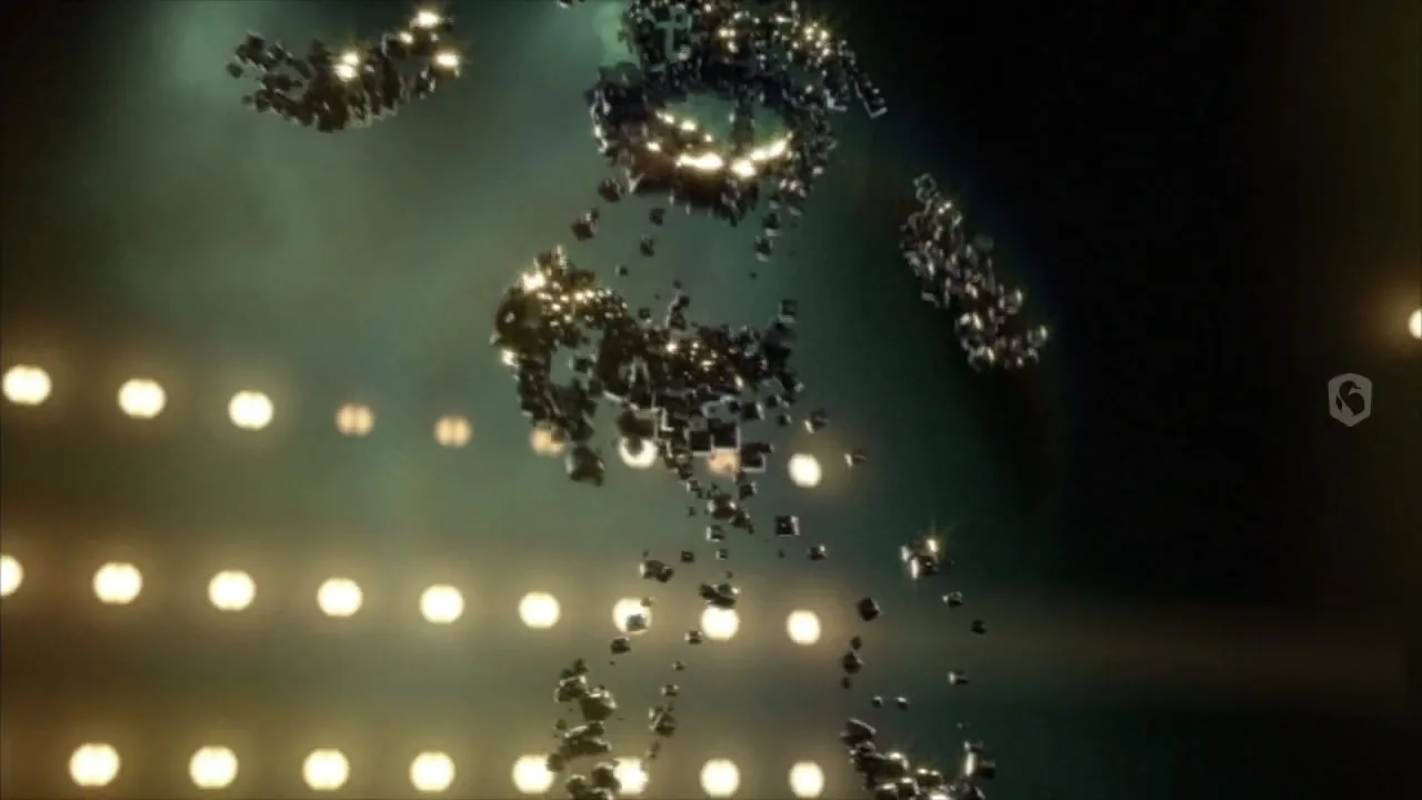 A human-like figure made of small, glowing cubes forms and moves against a dark background with rows of bright lights.