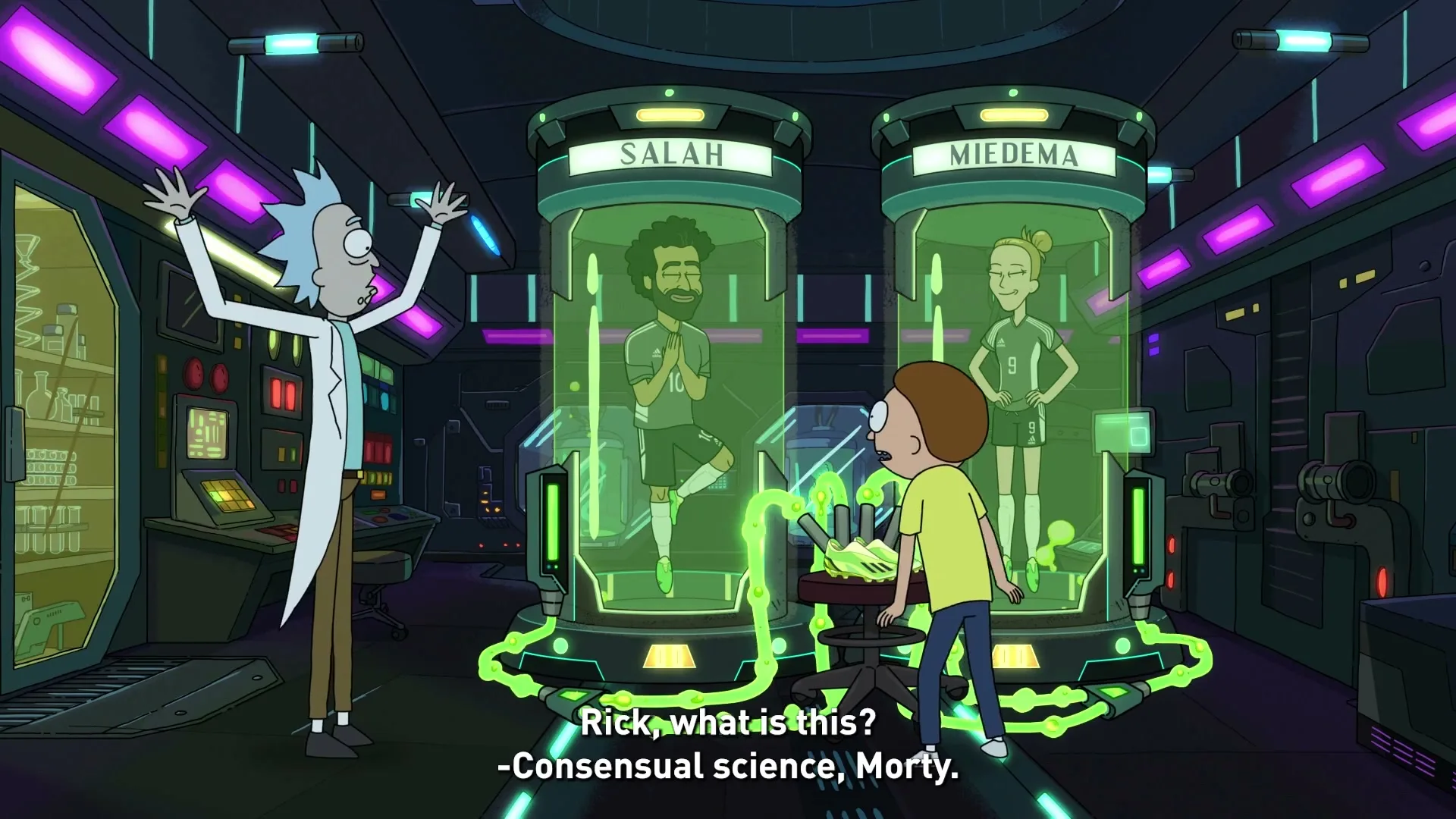 Rick and Morty stand in a futuristic lab, looking at two soccer players, Salah and Miedema, suspended in glowing green tubes.