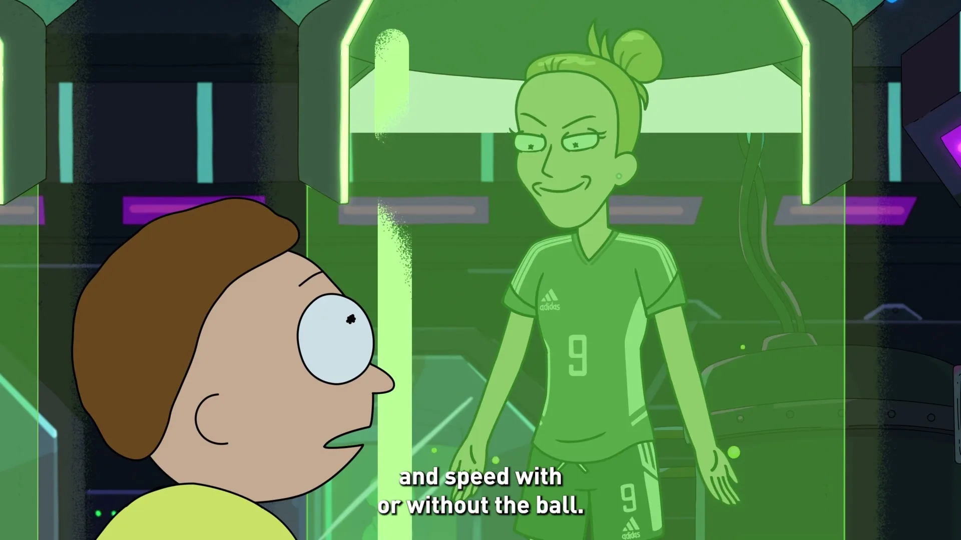Morty Smith looks at a green holographic projection of Vivianne Miedema, who is wearing a soccer uniform, in a futuristic lab.