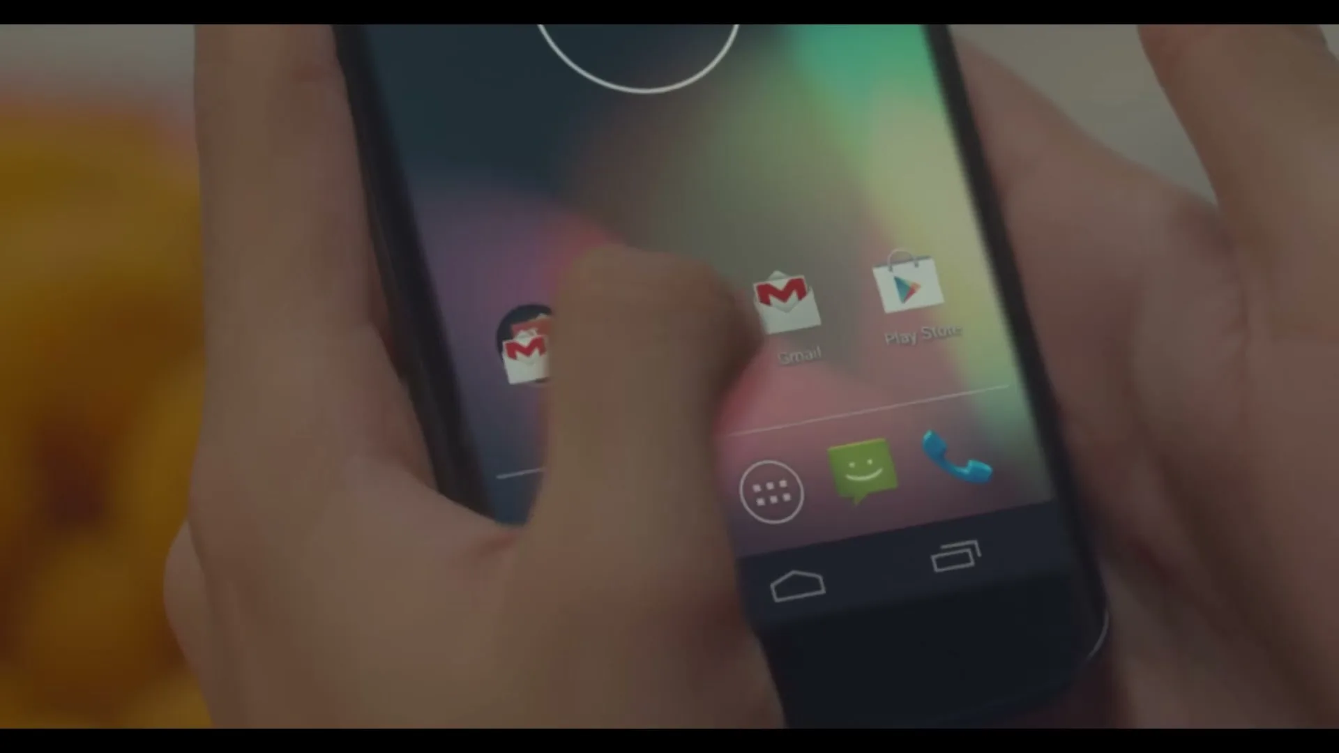 A person's hands hold a smartphone, their finger tapping the screen to open an application, revealing a white screen.