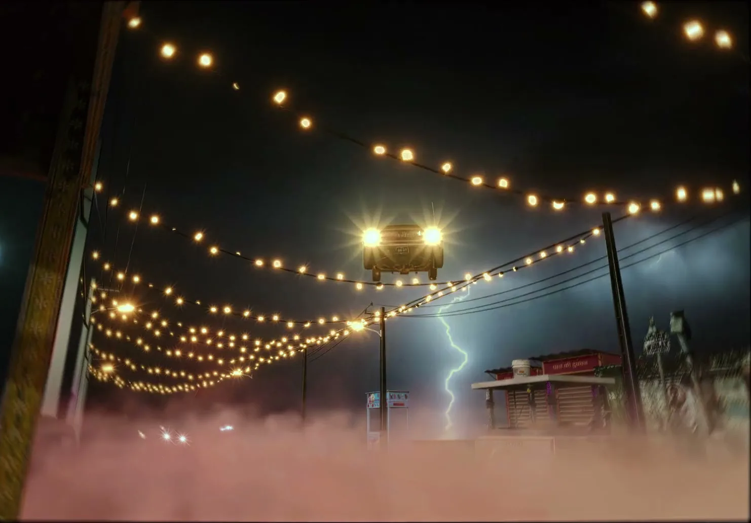 A red car with bright headlights drives towards the camera on a foggy street at night, with string lights and a lightning strike in the background.