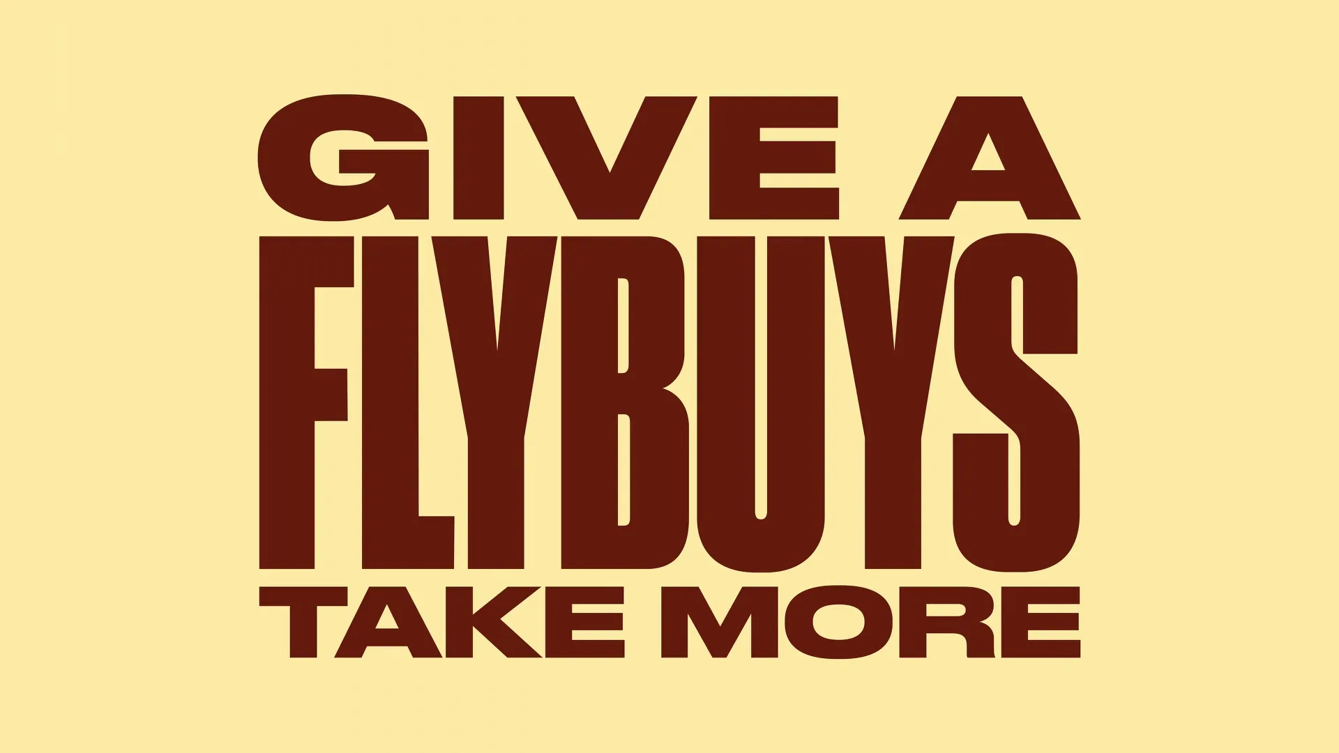 The words "GIVE A FLYBUYS TAKE MORE" are displayed in bold, brown letters on a light yellow background.