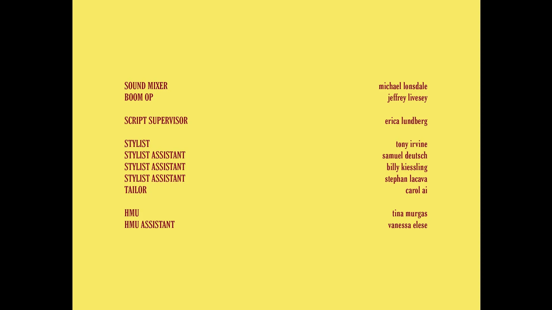A yellow screen displays red text listing crew members and their roles, including sound mixer, boom op, script supervisor, stylist, tailor, HMU, and HMU assistant.