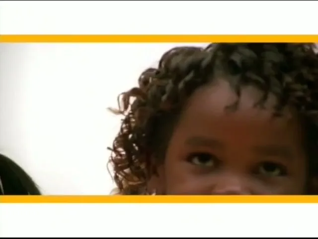 A young Black girl with curly hair looks up at the camera, superimposed over a vintage photo of male runners on a track.