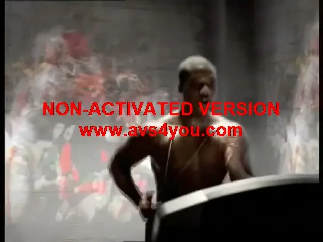 A shirtless male athlete with short hair runs on a treadmill in a dark, smoky gym, with blurred images of other athletes in the background.