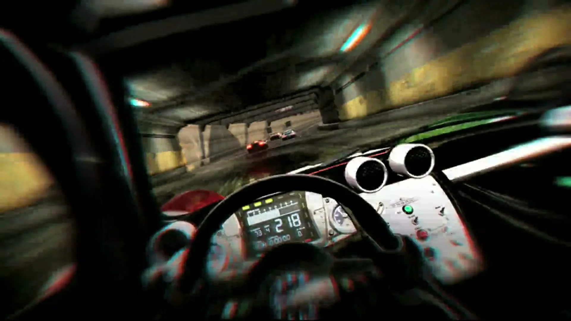 A first-person POV shot from inside a race car, showing the steering wheel and dashboard, as it speeds through a tunnel with other cars ahead.