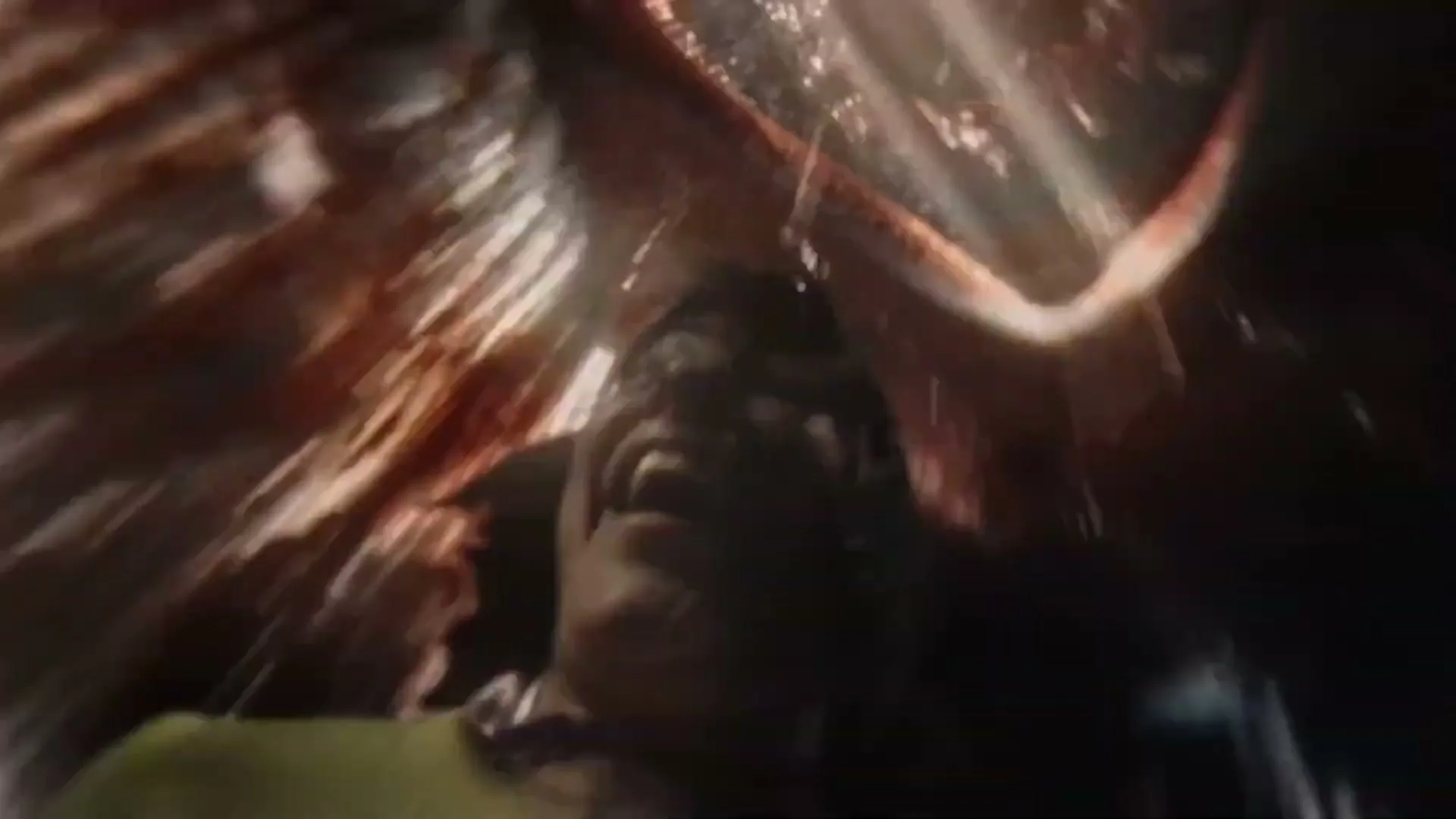 A person with long hair and a yellow shirt is seen from below, falling through a dark, abstract space with streaks of light and red.