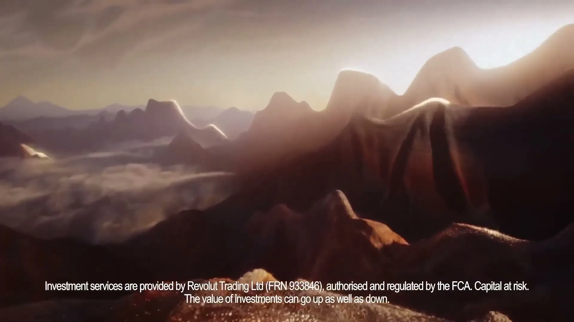 An aerial view of a vast, stylized mountain range with clouds in the valleys, bathed in the warm glow of a sunset.