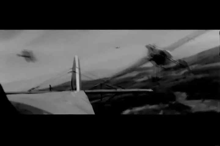 A black and white shot from inside a biplane shows another biplane flying past, with a third plane in the distance over a mountainous landscape.