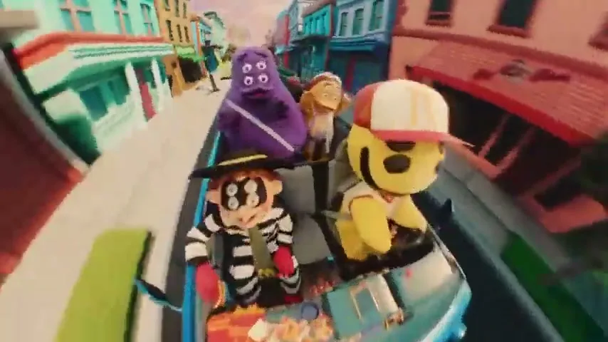 Four stylized characters, including a purple monster and a yellow smiley face, drive a blue car down a colorful, distorted street.