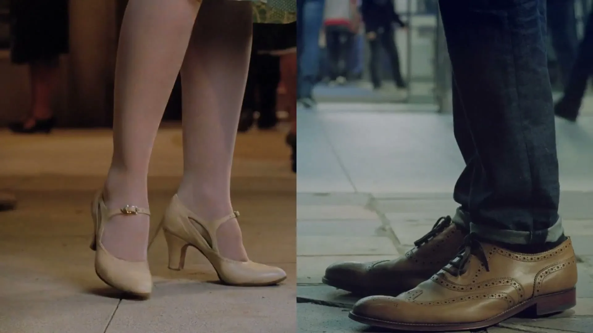A split screen shows a woman's legs in vintage heels on the left and a man's legs in brogues on the right, both standing still.