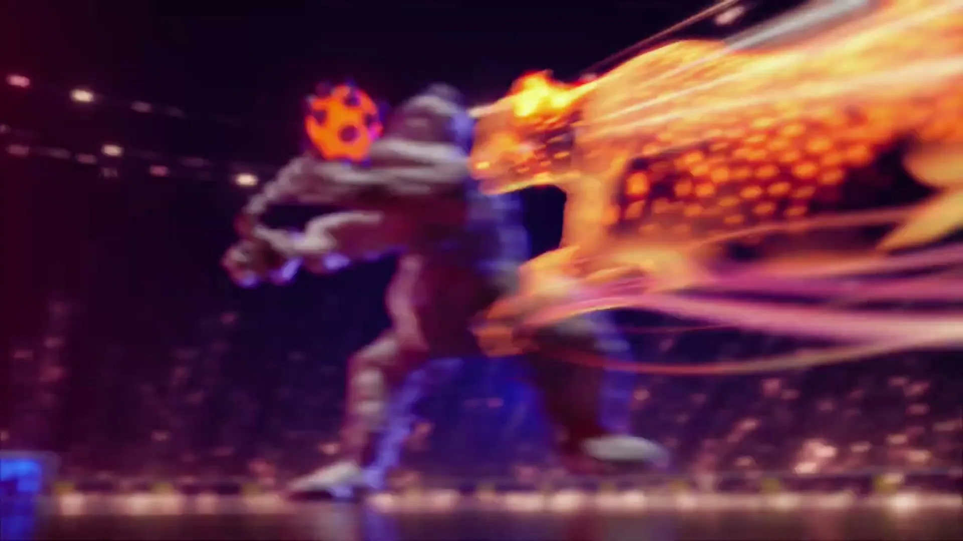 A stylized, glowing orange and black soccer ball is kicked by an unseen player in a dark stadium, leaving a fiery trail.