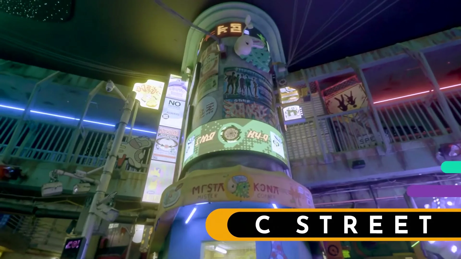 A wide shot of a futuristic, neon-lit interior with a large central pillar covered in various signs and screens, with the text "C STREET" overlaid.