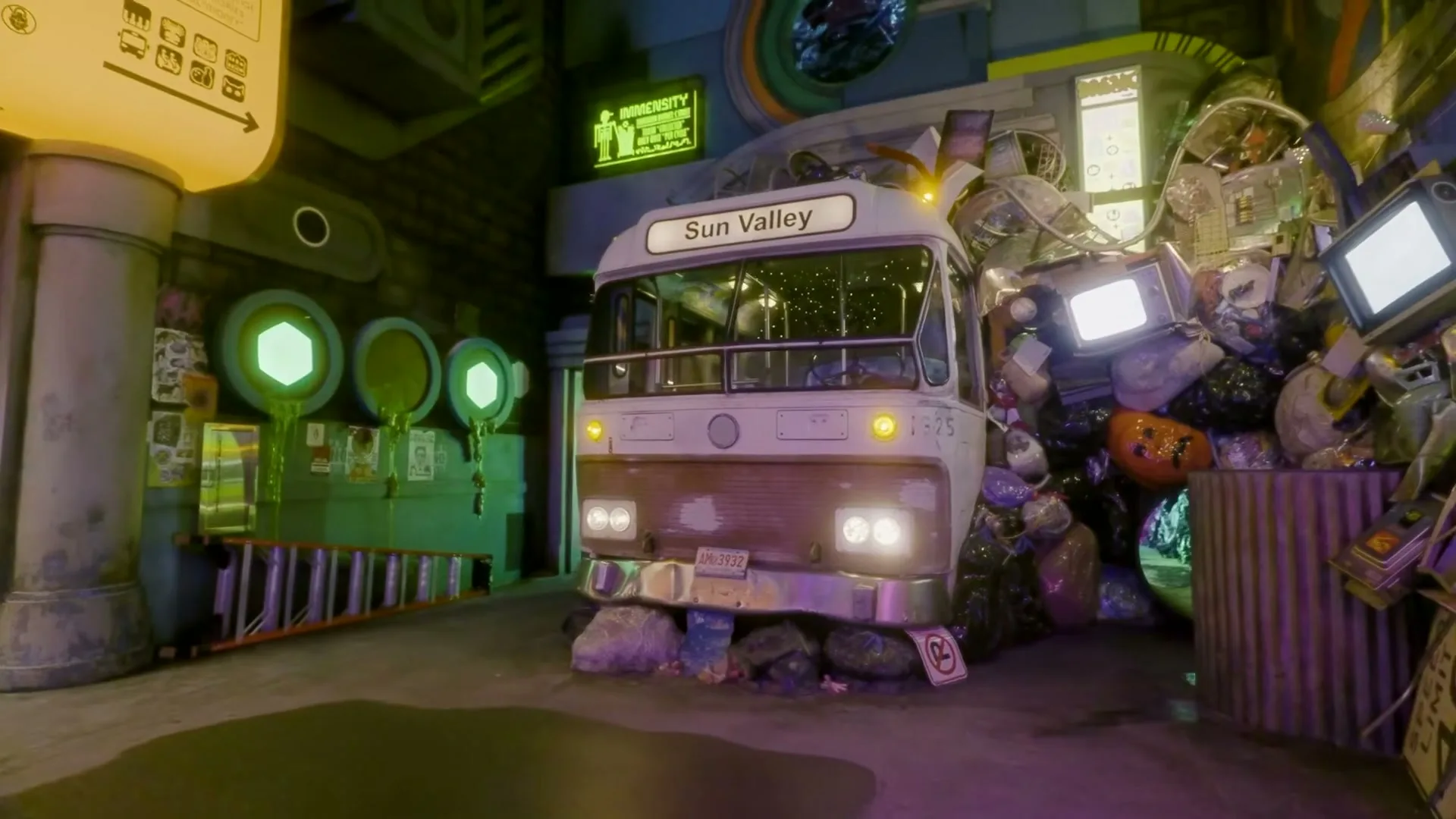 A white bus with "Sun Valley" on its destination sign is parked in a fantastical, neon-lit, trash-filled alleyway, with glowing green circles on the left.