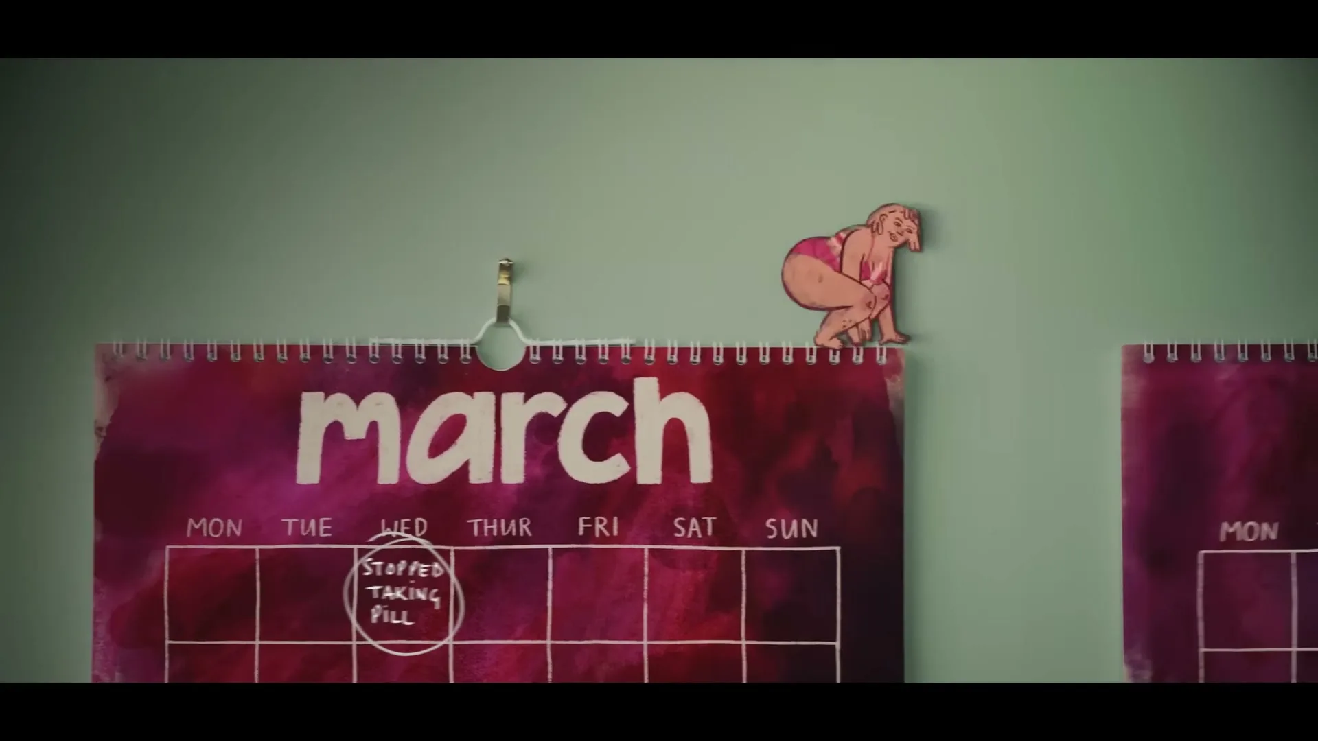 A stop-motion animation shows a paper cutout of a woman in a pink bikini walking across a calendar from March to April, with "STOPPED TAKING PILL" circled on March 2nd.