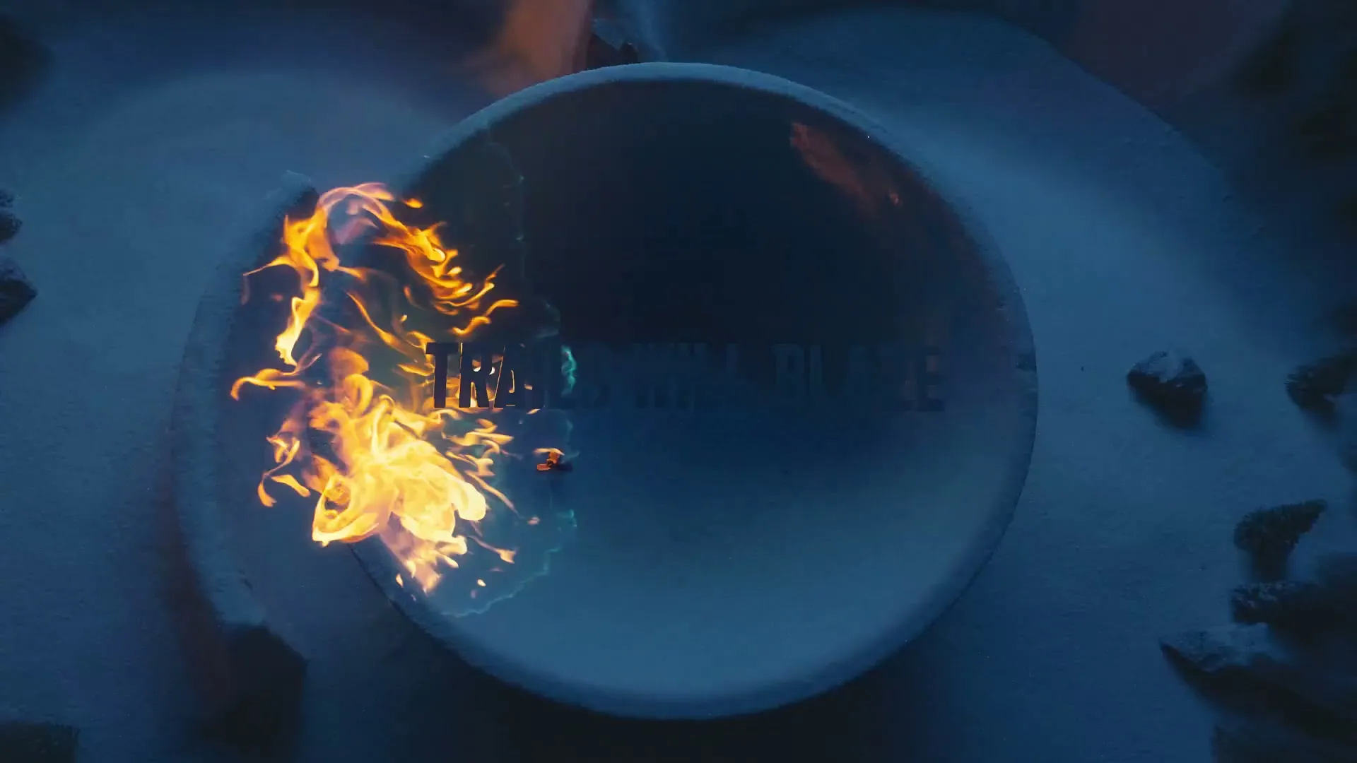 A close-up shot shows a circular, snow-covered surface with the words "TRAILS WILL BLAZE" appearing as fire spreads across it.