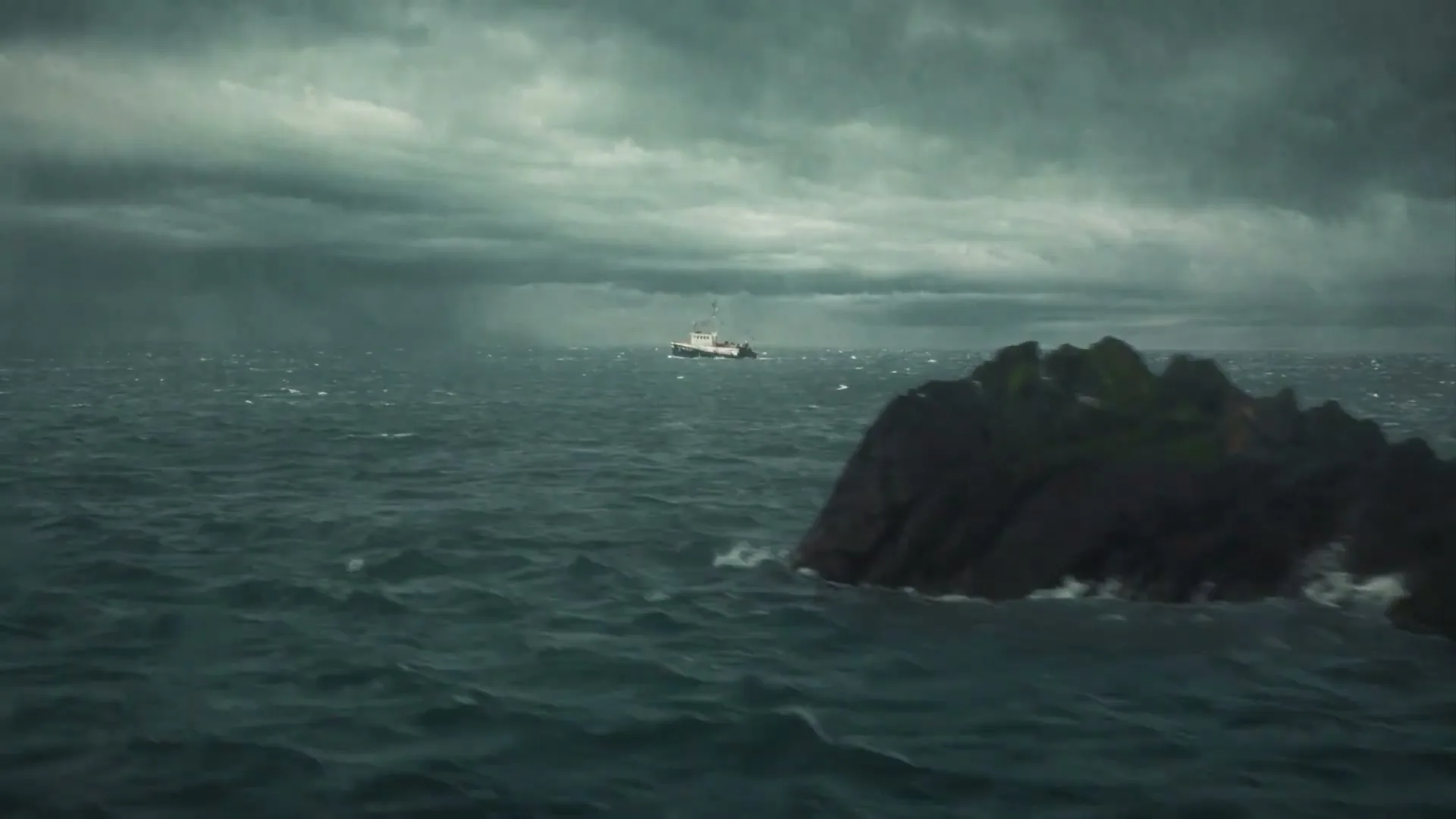 A fishing boat sails on a stormy sea with dark clouds and a rocky island in the foreground.